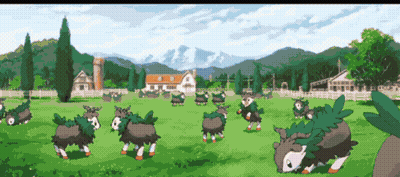 Sheep Standing in Field With Mountains