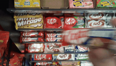 Shelf Full Of Candy Including KitKats And Mirage GIF
