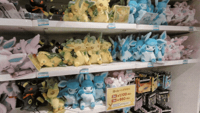 Shelf Full Of Stuffed Animals With Sign Saying 1,100 GIF