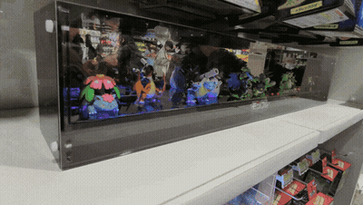 Shelf Full Of Stuffed Pokemon Squirtle And Flareon GIF