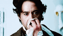 Sherlock Robert Downey Covering Nose GIF