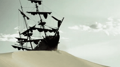Ship Silhouetted Against Cloudy Sky On Sand Dune GIF