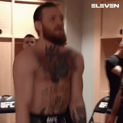 Shirtless Bearded Fighter In Locker Room GIF