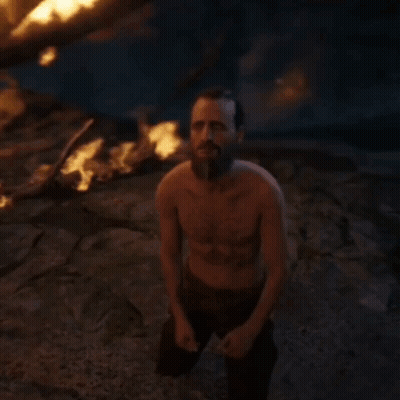 Shirtless Bearded Man Holding Sword At Fire GIF