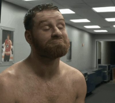 Shirtless Bearded Man In Hallway With Hockey Picture GIF