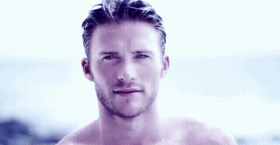 Shirtless Bearded Man Standing By Ocean GIF