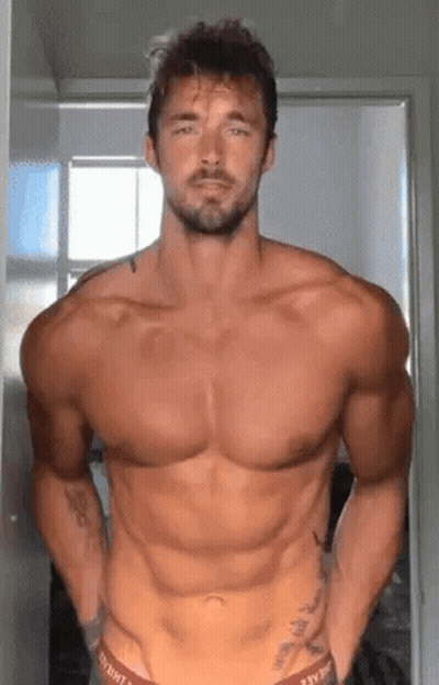 Shirtless Bearded Man Standing In Room GIF
