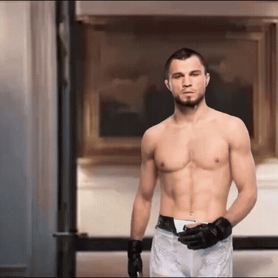 Shirtless Boxer Standing In Front Of Framed Picture GIF