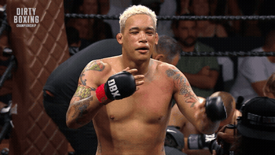 Shirtless Boxer With DBX Boxing Gloves In Ring GIF