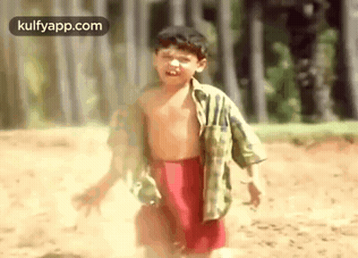 Shirtless Boy In Red Shorts Running In Dirt GIF