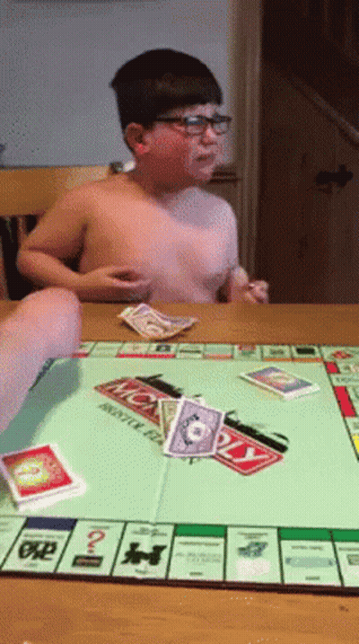 Shirtless Boy Playing Monopoly GIF