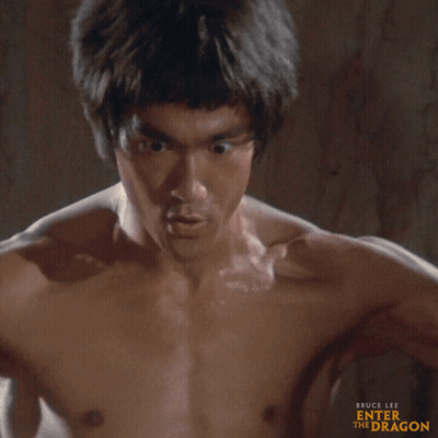 Shirtless Bruce Lee Close Up GIF