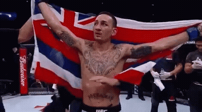 Shirtless Fighter Holding British Flag GIF