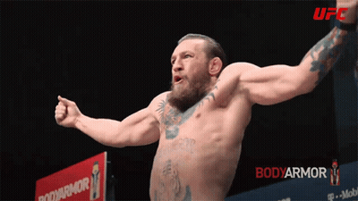 Shirtless Fighter In Front Of Bodyarmor Sign GIF