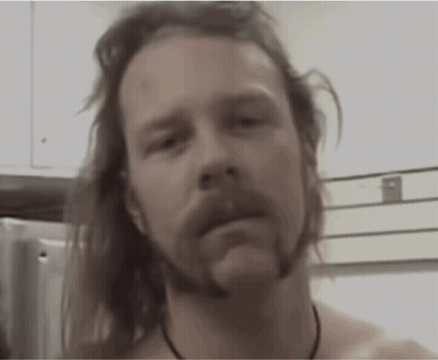 Shirtless Long-Haired Bearded Man Looking At Camera GIF