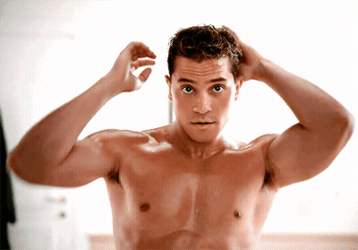 Shirtless Man Adjusting Hair In Mirror GIF