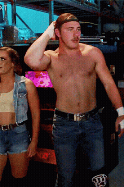 Shirtless Man And Woman In Denim Vest GIF