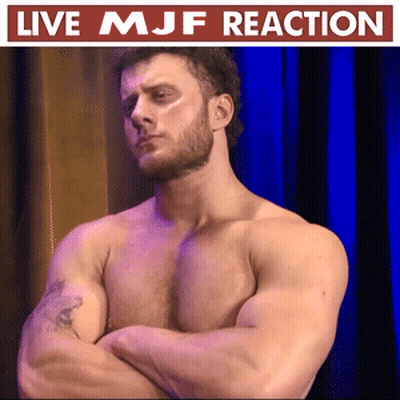 Shirtless Man Arms Crossed Blue Curtain Live MJF Reaction GIF