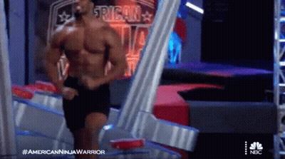 Shirtless Man At American Ninja Warrior Sign GIF