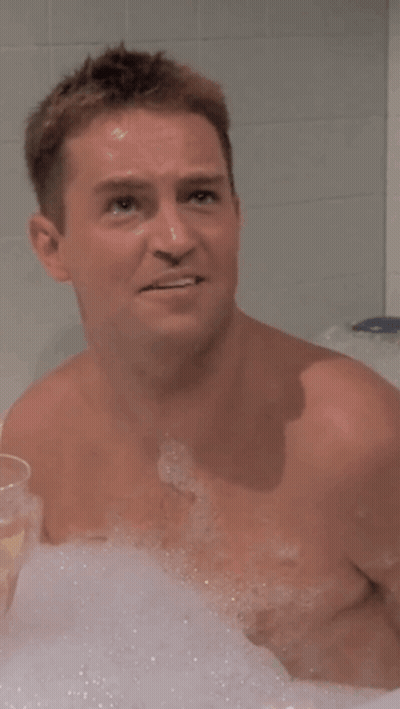 Shirtless Man Bathing With Wine GIF