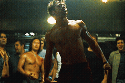 Shirtless Man Before Group Of Men GIF