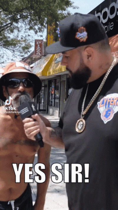 Shirtless Man Being Interviewed GIF