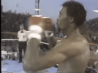Shirtless Man Boxing Gloves In Ring GIF