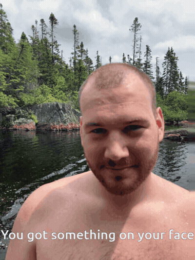Shirtless Man By Water Saying You Got Something On Your Face GIF