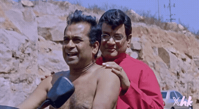Shirtless Man Comforted By Shirtless Man With Glasses GIF