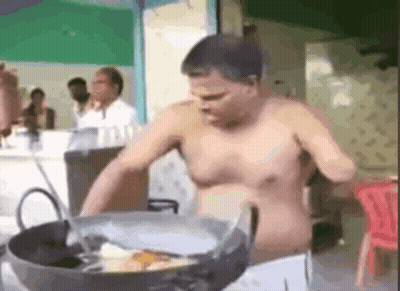 Shirtless Man Cooking In Pot In Restaurant GIF