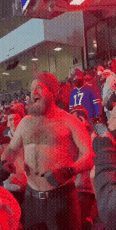 Shirtless Man Dancing At Football Game GIF