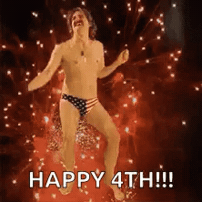 Shirtless Man Dancing In Front Of Fireworks GIF