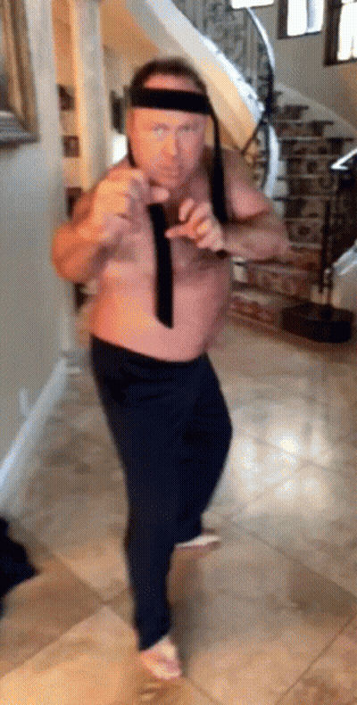 Shirtless Man Dancing In Hallway With Stairs GIF