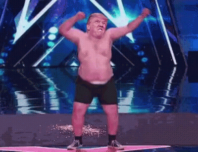 Shirtless Man Dancing On Stage Arms Up GIF