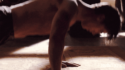 Shirtless Man Doing Push Ups On Wooden Floor GIF