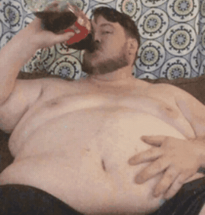 Shirtless Man Drinking Coke On Couch GIF