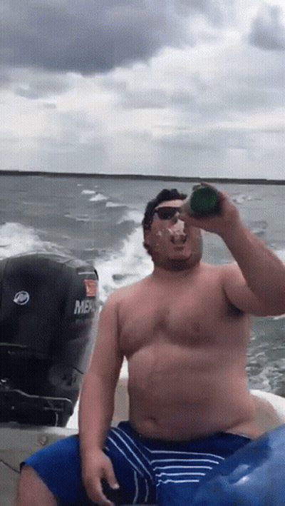 Shirtless Man Drinking From Bottle On Mercruiser Boat GIF