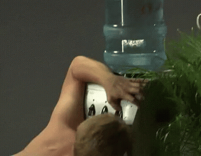 Shirtless Man Drinking Water From Water Dispenser GIF