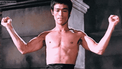 Shirtless Man Flexing Muscles GIF