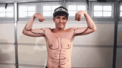 Shirtless Man Flexing Muscles In Front Of Garage Door GIF