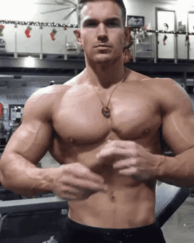 Shirtless Man Flexing Muscles In Gym GIF
