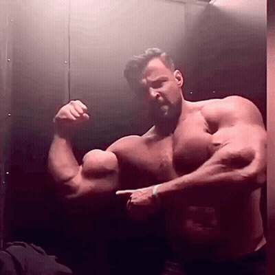Shirtless Man Flexing Muscles In Mirror GIF