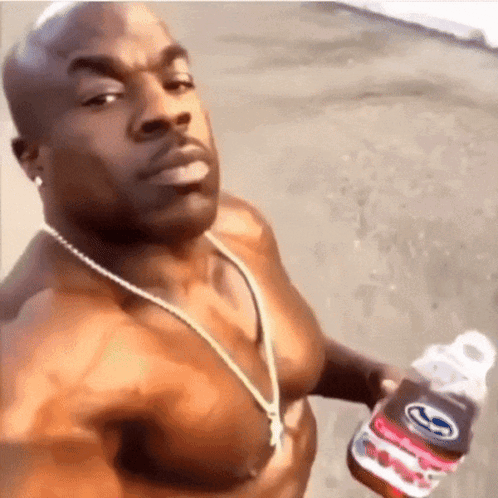 Shirtless Man Holding Bottle Of Soda GIF