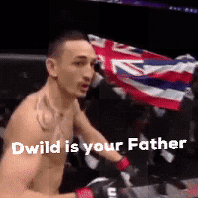 Shirtless Man Holding Flag In Boxing Ring GIF