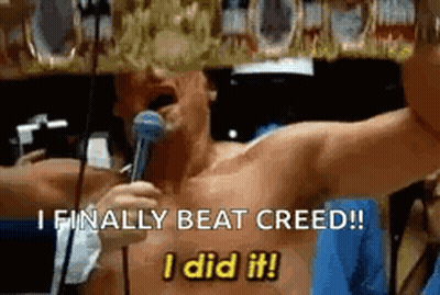 Shirtless Man Holding Microphone Says I Finally Beat Creed GIF