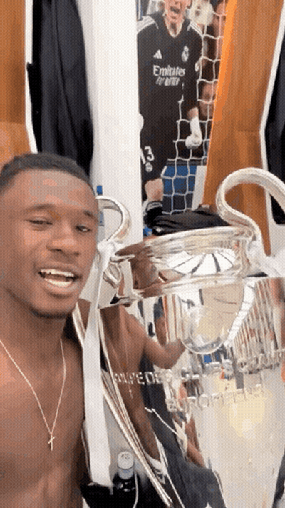 Shirtless Man Holding Trophy Saying Emirates GIF