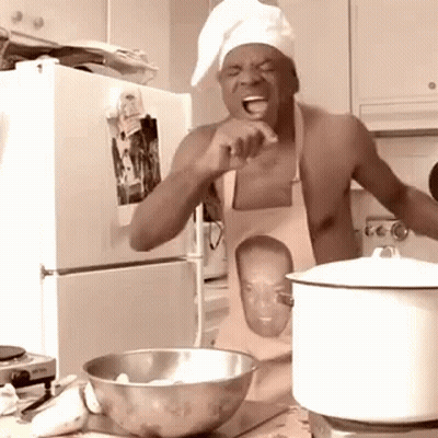 Shirtless Man In Apron Cooking In Kitchen GIF