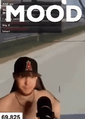 Shirtless Man In Baseball Cap Sitting In Front Of Microphone GIF