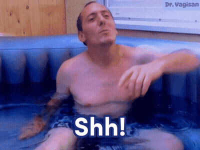 Shirtless Man in Bathtub Saying Shh