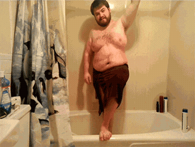 Shirtless Man In Bathtub With Penguin Shower Curtain GIF